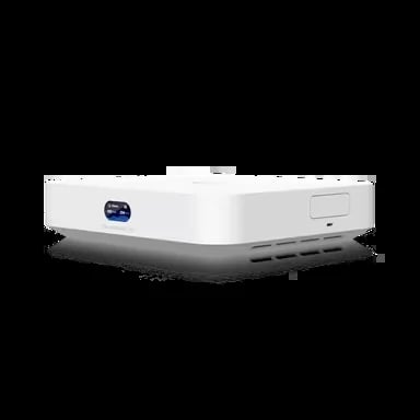 White compact projector with blue lens indicator and control buttons on a dark surface