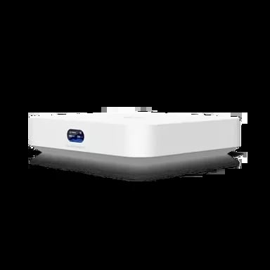 White compact projector with small blue light indicator on front, shown at an angle
