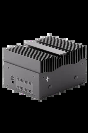 Industrial fanless computer with aluminum heatsinks and ventilation ports, shown at an angle against a white background