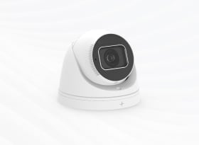 White dome security camera with dark lens on white background